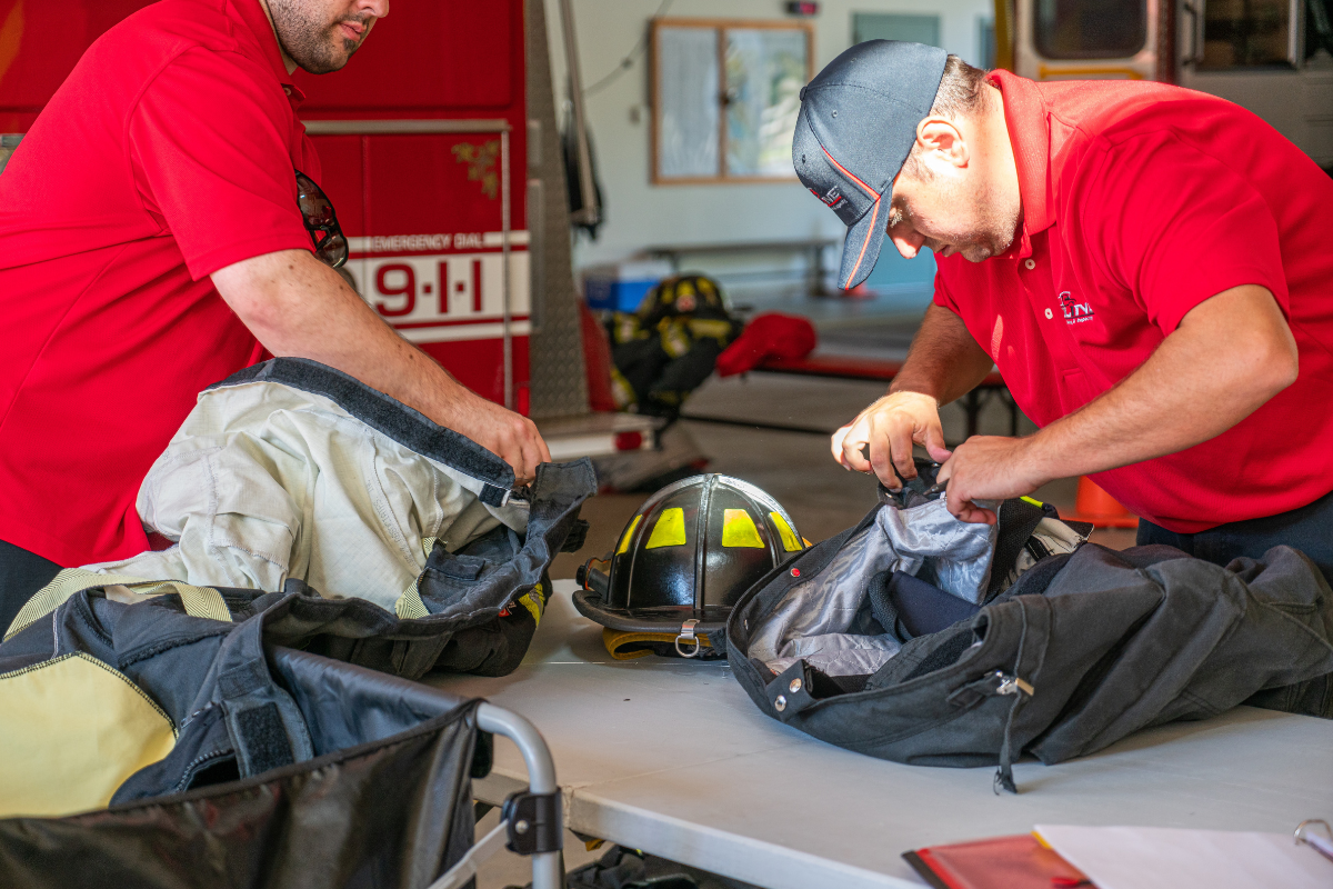 fire fighters working on gear